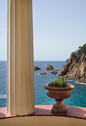 A vertical shot of the view of a beautiful Costa Brava coastline near Lloret de Mar from a balcony