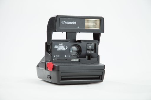 A closeup shot of a poloroid camera on white background
