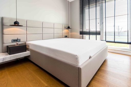 The double bed in the bedroom of a modern apartment - home sweet home