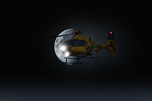 An ADAC helicopter in front of half moon Composing
