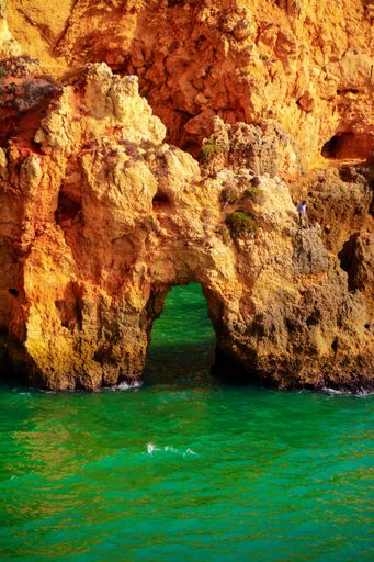 A vertical shot of the Farol da Ponta da Piedade in Lagos, Portugal during daylight