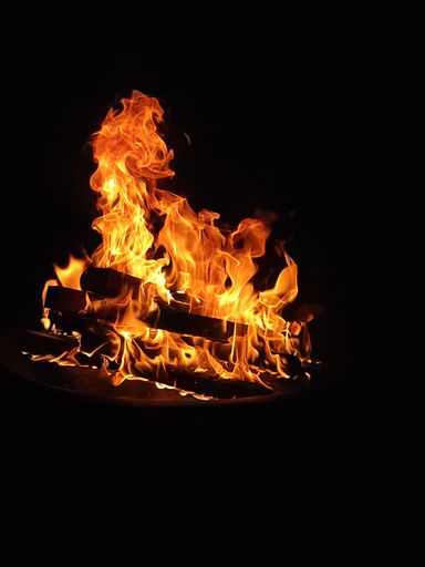 A beautiful view of a bonfire on a dark background