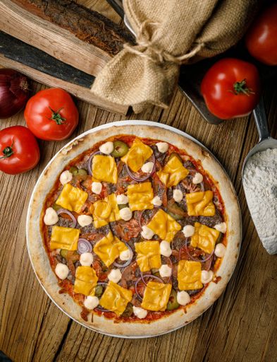 A freshly baked pizza on a wooden table