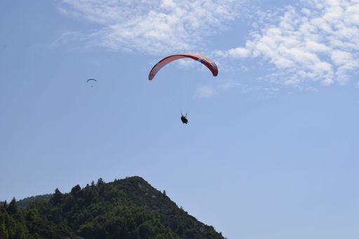 A skydiving with cliff in background