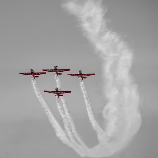 The planes with smoke on the tail in the sky
