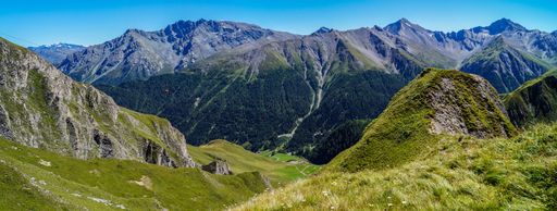 A beautiful panoramic shot of majestic Alps in summer. Silvretta High Alpine Road, Switzerland.