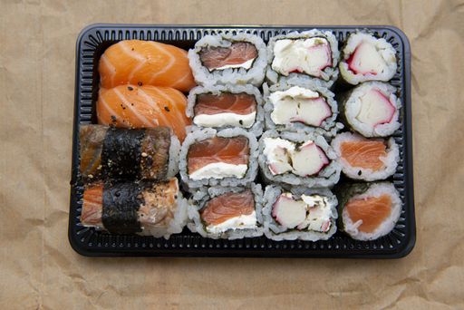 A closeup shot of assorted sushi on the table