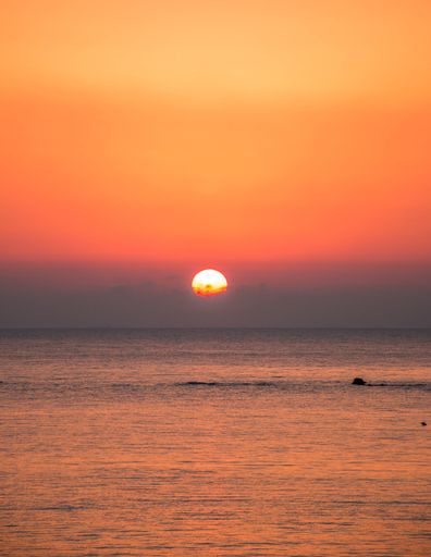 A vertical shot of a beautiful sunset over the Adriatic sea