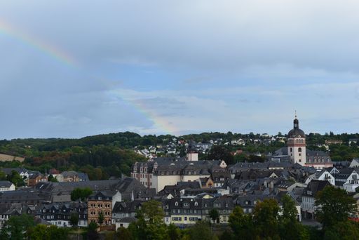 An aerial view of cityscape Weilburg surrounded by buildings