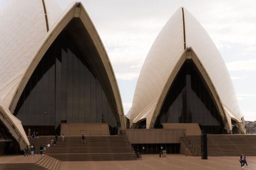 The entrance to the famous Sydney Harbour Opera house against a cloudy sky