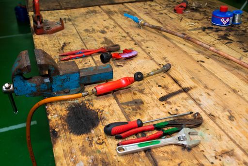 Plumber and tin soldering tools on a workbench