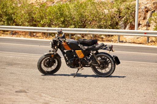 A Gemini Scrambler parked on the road on a sunny day in Lindos, Greece