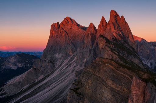 A beautiful shot of dolomite mountains in Seceda, Italy during sunset