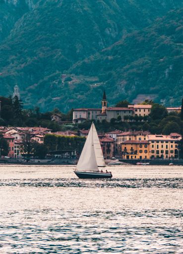 A boat floating near the mountains