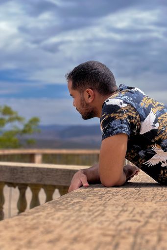 A portrait of a man looking away at the city