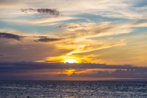 A beautiful view of a stunning golden sunset over the ocean