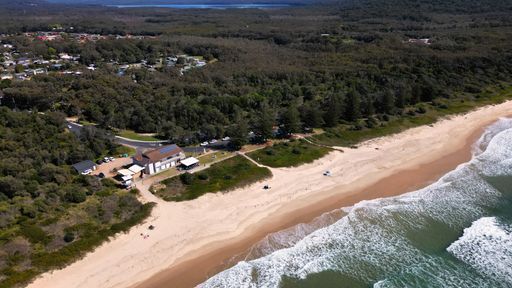 A beautiful view of ocean waves against a sandy coastline of North Haven