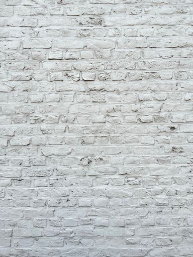 A white brick background or wallpaper, closeup shot