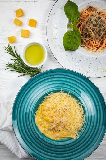 An overhead view of an assortment of freshly cooked pasta dishes
