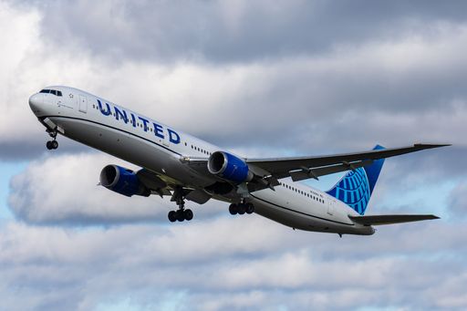 A beautiful shot of United airlines Boeing against a cloudy sky background