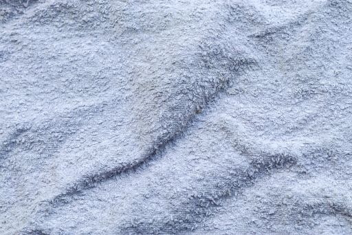 A closeup shot of textured fluffy white fabric