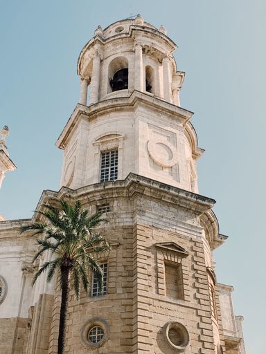 A vertical low angle shot of the Cadiz Cathedral in Cadiz, Spain