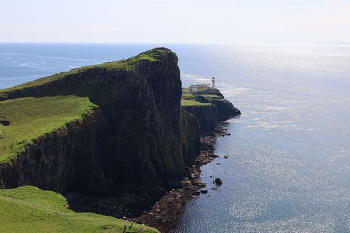 A lighthouse in Scotland near see and cliffs