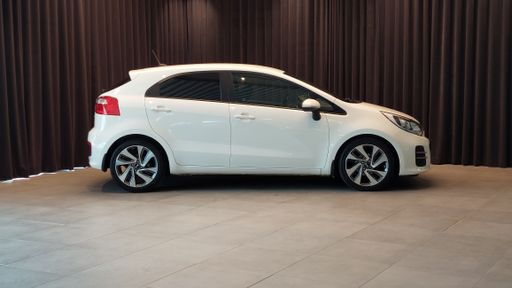 Kia Rio 2015 car exterior view front back side no people indoor in studio inside car dealership showroom