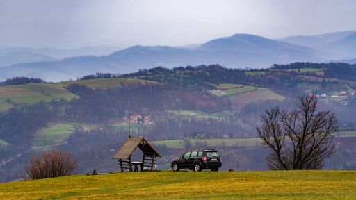 A car  parked on the camping spot overlooking the mountain landscape in Rajac, Serbia