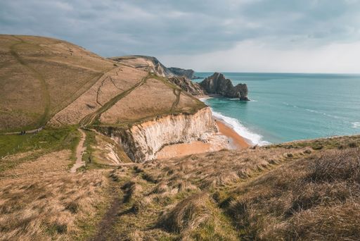 a high angle shot of Durdle Door limestone arch on the Jurassic Coast near Lulworth in Dorset, England