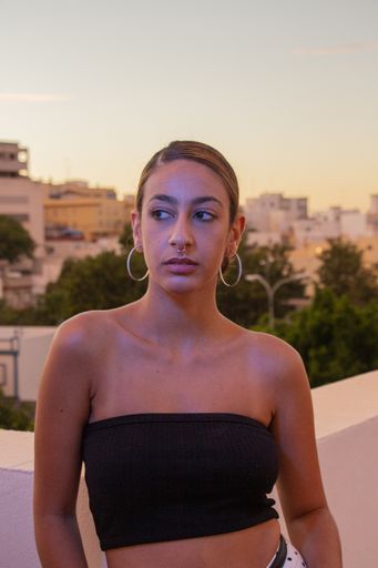 A shallow focus shot of an attractive caucasian female posing at camera