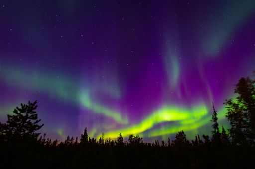 A green neon Aurora Borealis in the sky