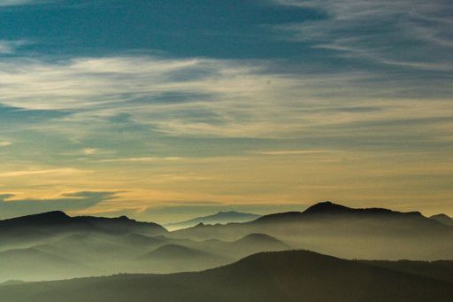A mesmerizing view of a golden sunset over mountains