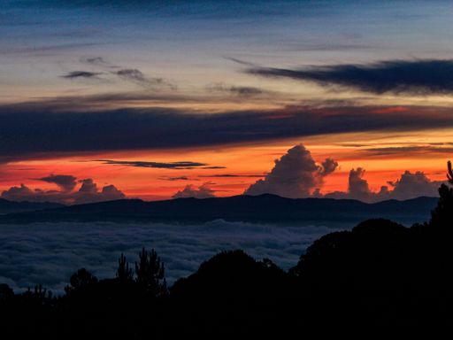 A mesmerizing view of a golden sunset over mountains