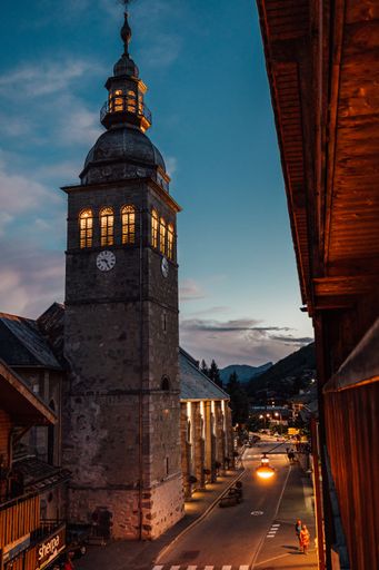 A vertical shot of the tower of Our Lady of Assumption Church in Le Grand Bornand, France