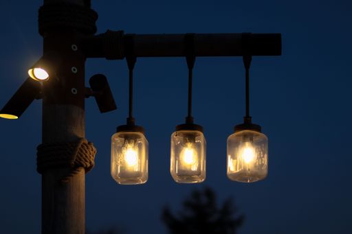 A closeup shot of abstract street light bulbs on a wooden pole