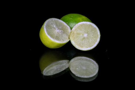 A cut lemon isolated on black background
