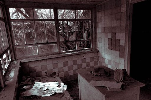 The inside of an abandoned interior in Ukraine, red toned