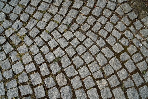 A high angle shot of an abstract background of a cobblestone