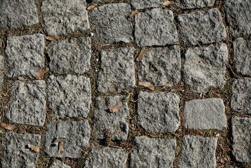 A high angle shot of an abstract background of a cobblestone