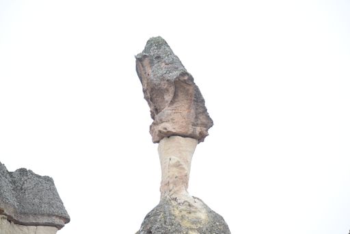 A rock formation in white background
