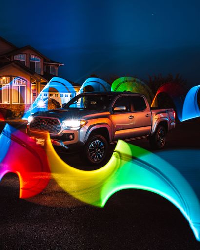 An incredible night long exposure shot of a Toyota Tacoma