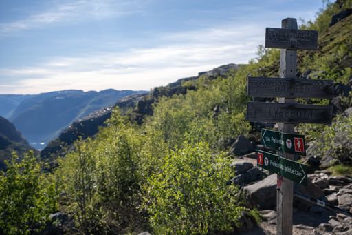 Strand, Norway - June 6, 2022:  Wonderful landscapes in Norway. Walking through the path to the Preikestolen pulpit rock. Sunny spring day