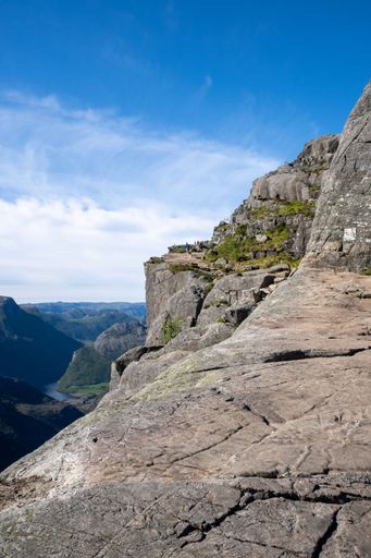 Strand, Norway - June 6, 2022:  Wonderful landscapes in Norway. Walking through the path to the Preikestolen pulpit rock. Sunny spring day