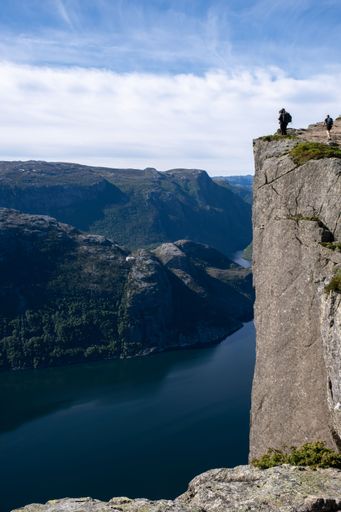 Strand, Norway - June 6, 2022:  Wonderful landscapes in Norway. Walking through the path to the Preikestolen pulpit rock. Sunny spring day
