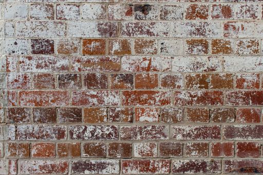 Red brick wall texture background with white paint
