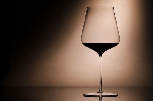 A closeup shot of a glass of red wine