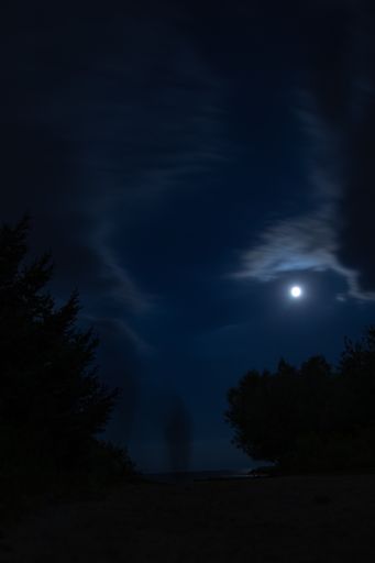 A beautiful scenery of the full moon over a landscape