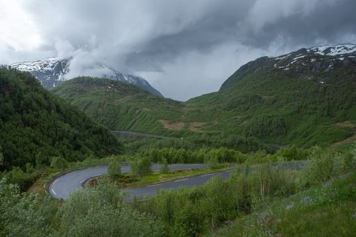 Wonderful landscapes in Norway. Vestland. Beautiful scenery on the Austmannalia scenic route. Mountains, rocks and snow in background. Cloudy day