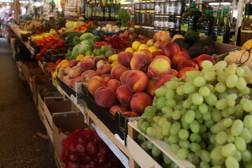 A line of vegetables and fruits for sale at a bazaar in Croatia